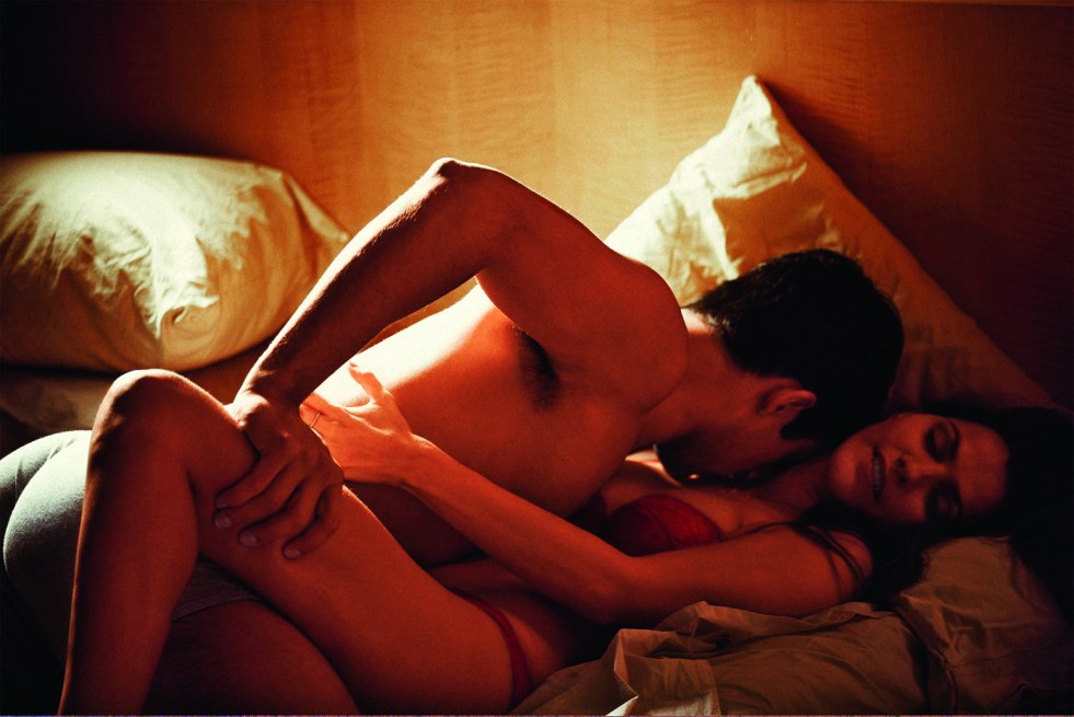Erotic guy and girl in bed