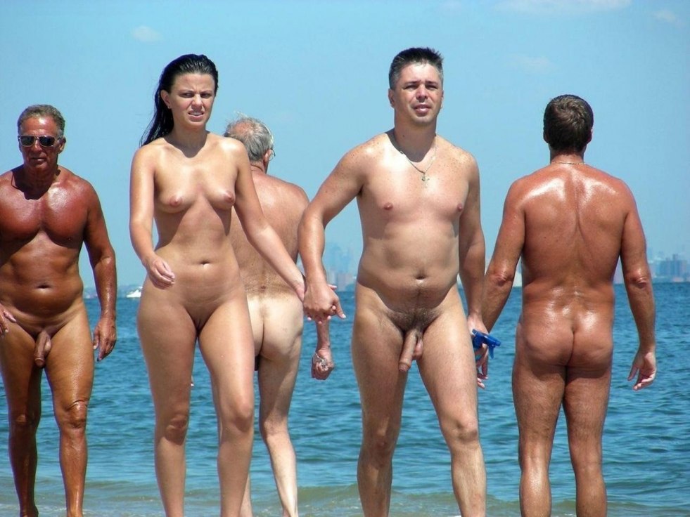 Naked men and women on the beach