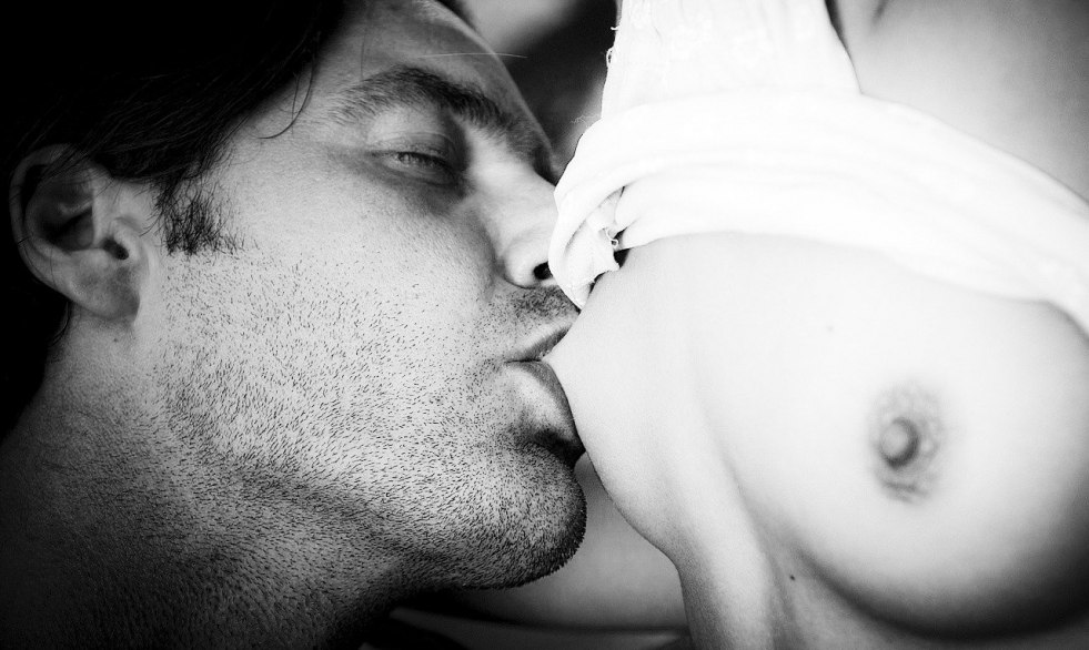 Passionate Kiss of Female Breast