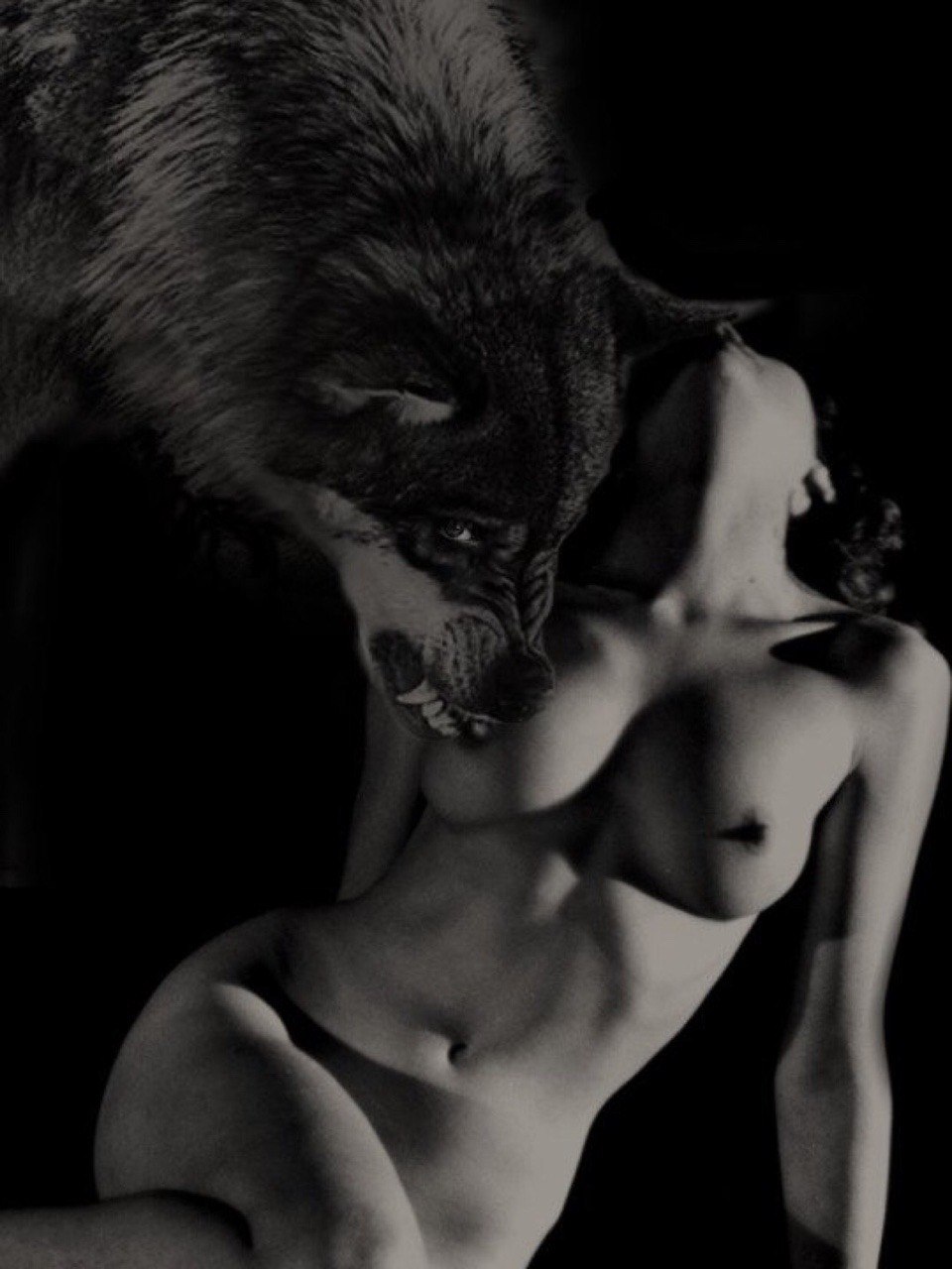 Naked beauty with wolf