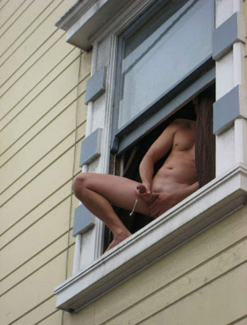 Naked woman through the window