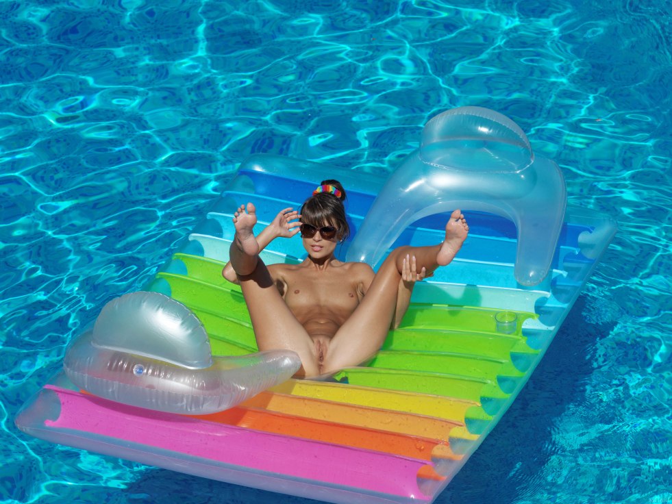 Naked woman on an inflatable mattress