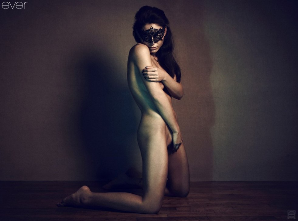 Naked in a masquerade mask