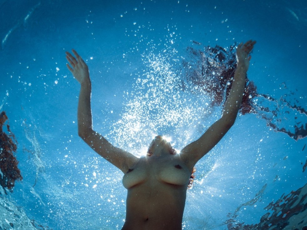 Topless girls under water