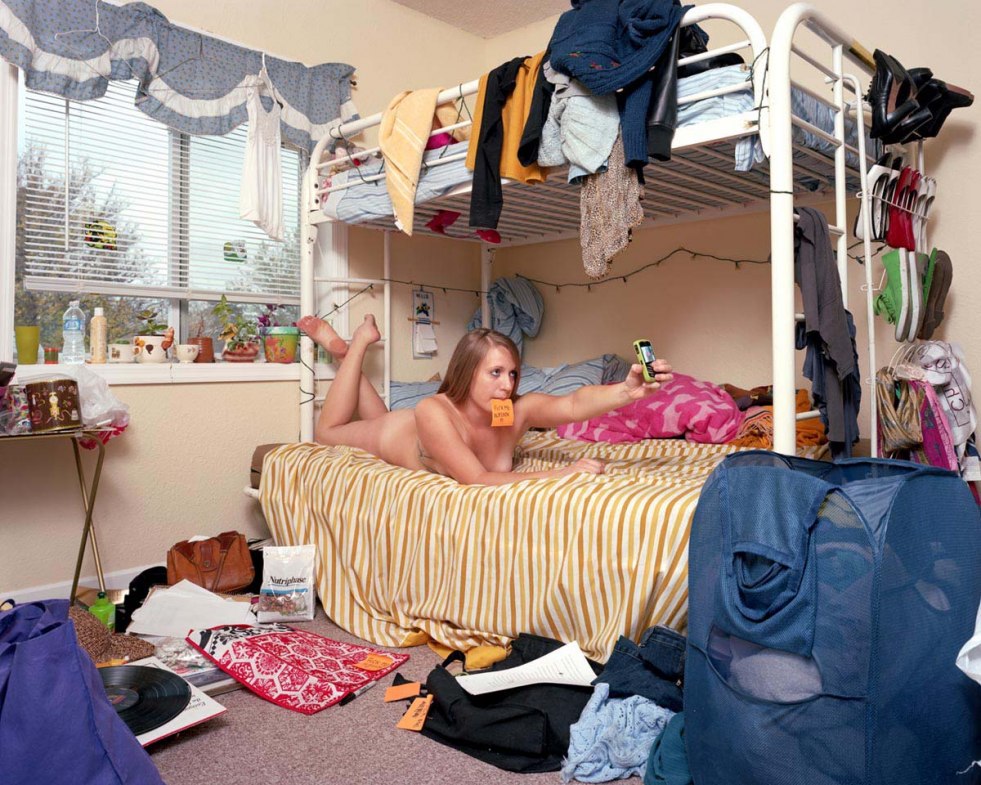 Girl undresses in the room