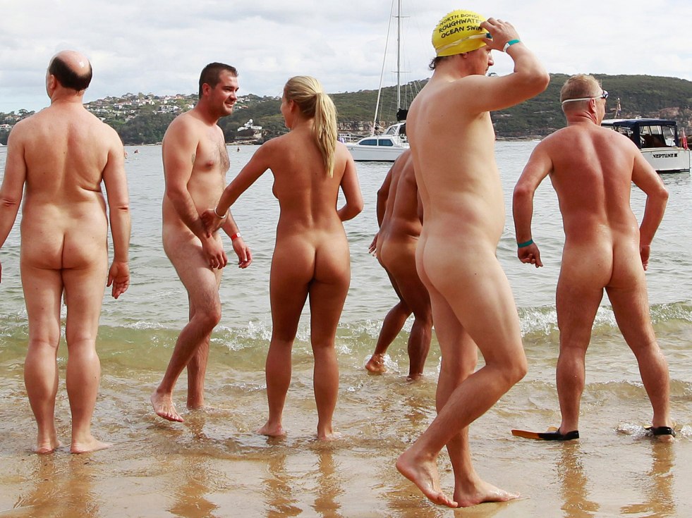 Crowd of naked people on the beach