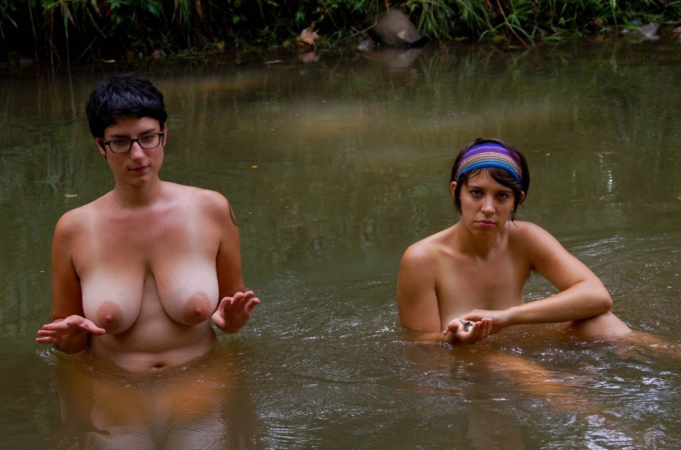 Women bathe in the river naked