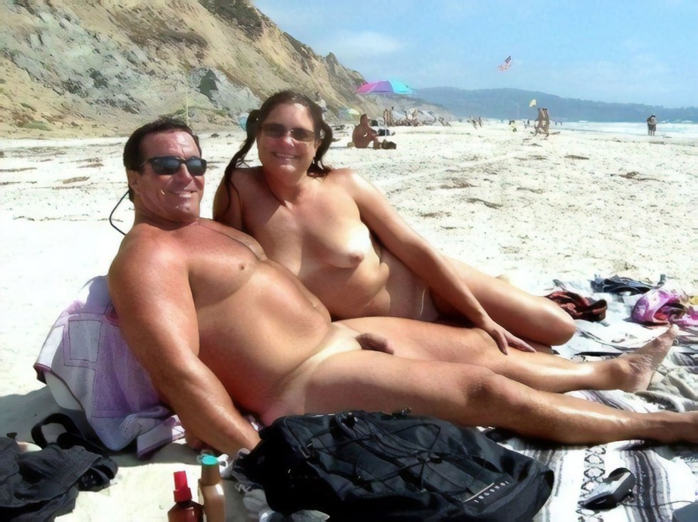 Family couples on a nudist beach