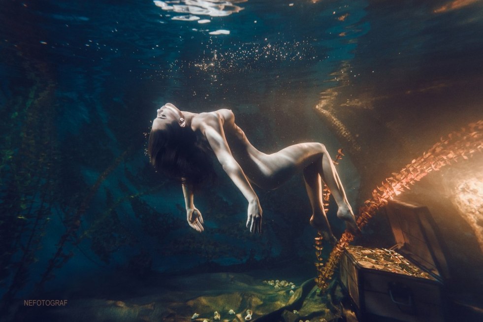 Naked with scuba under water
