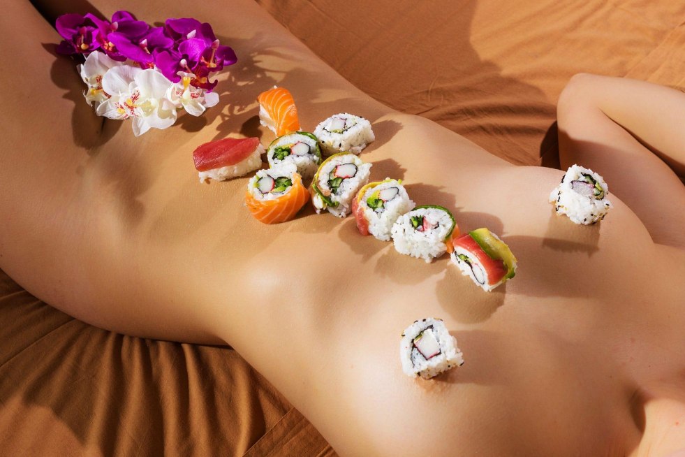 Sushi on the girl's body