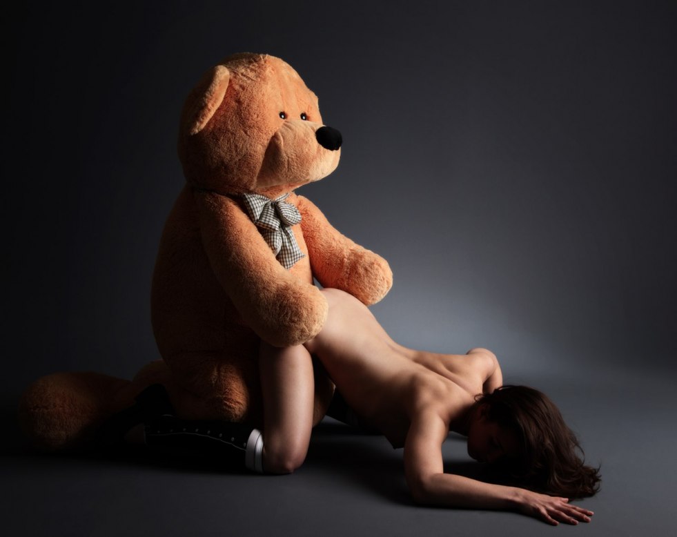 Naked with a teddy bear