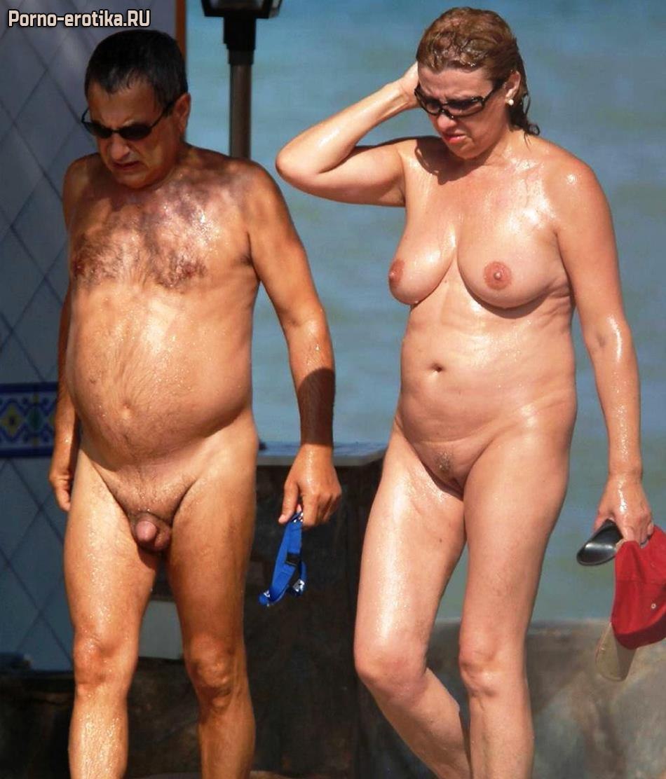 Ladies sunbathe naked on the beach