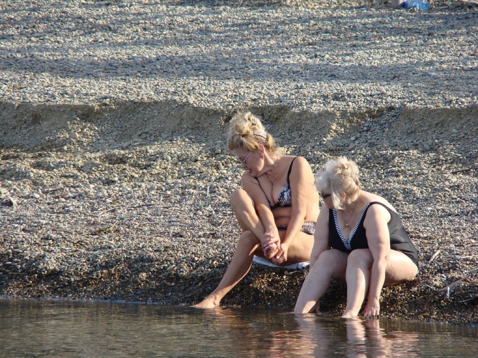 Women bathe in the nude river