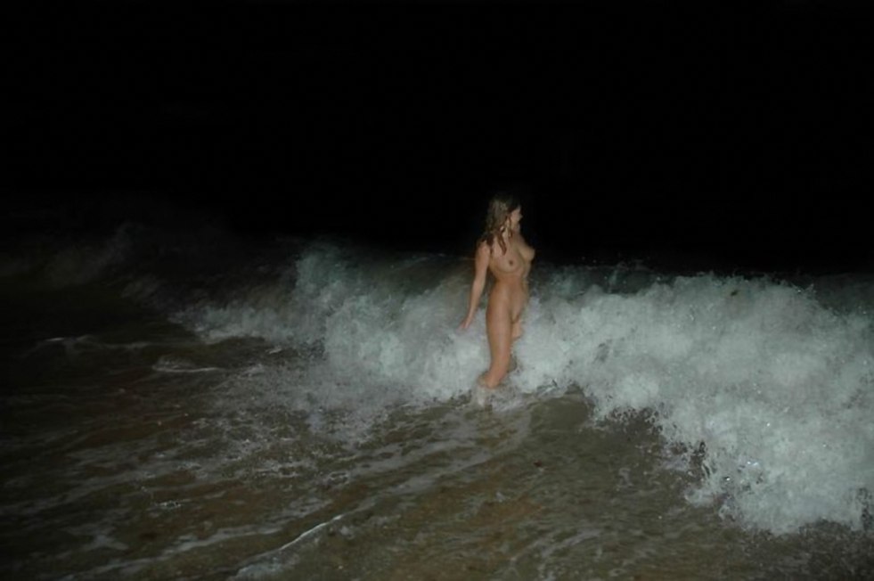 Beautiful naked woman in water