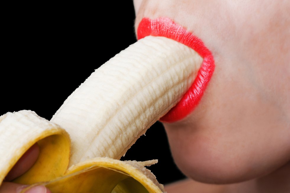 Banana with cream in the mouth