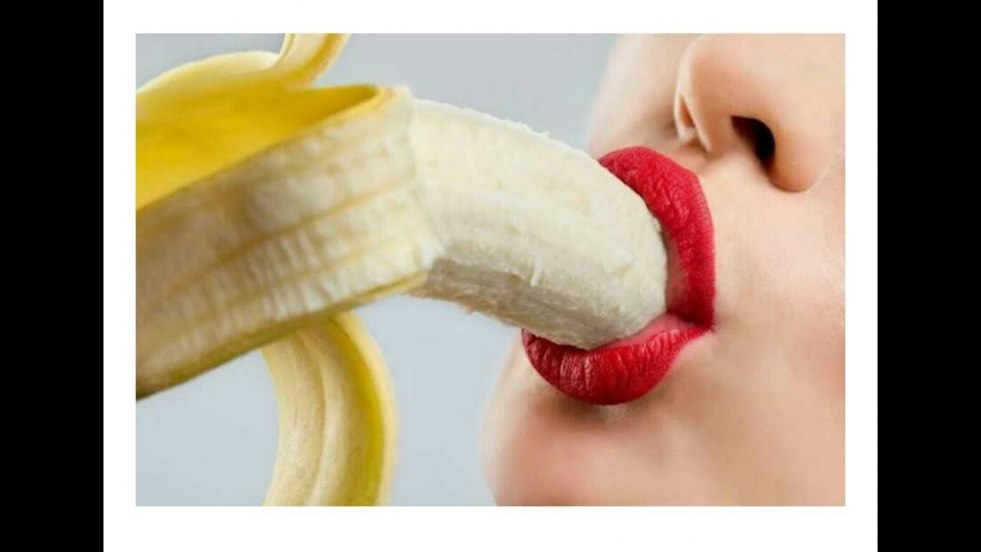 Girl with banana in mouth