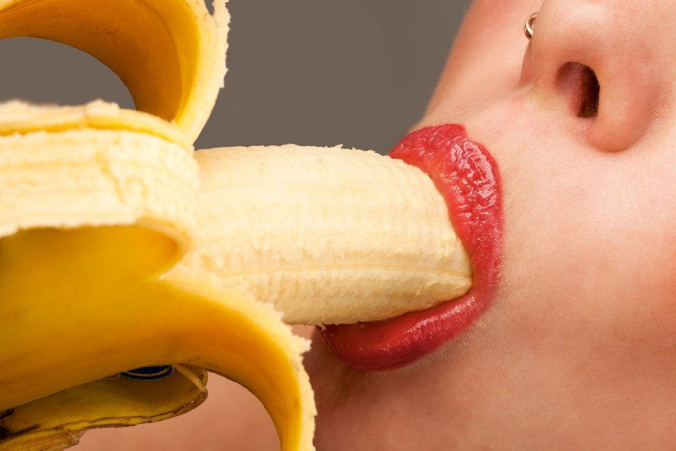 Girl licks banana