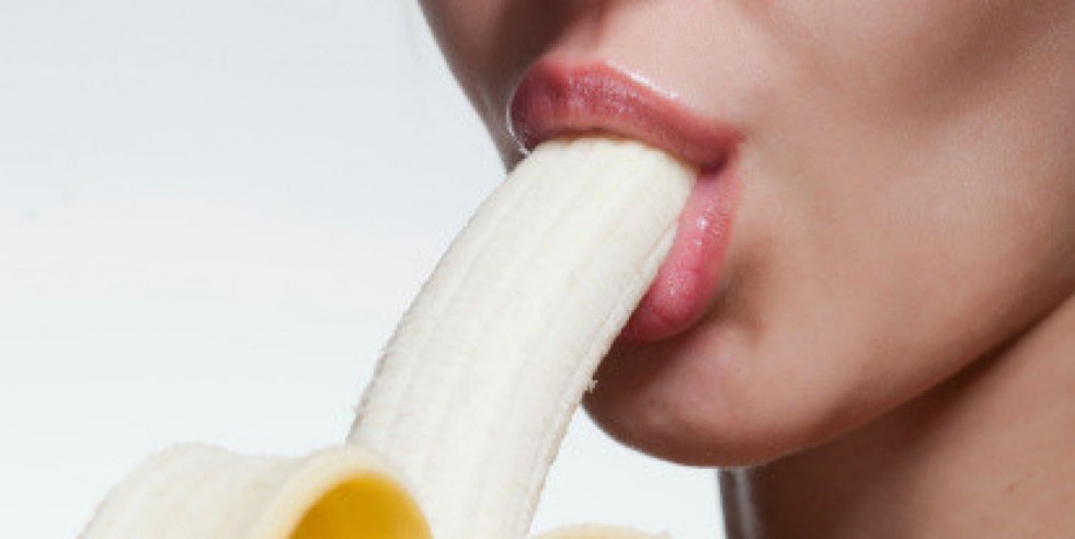 Girl licks banana