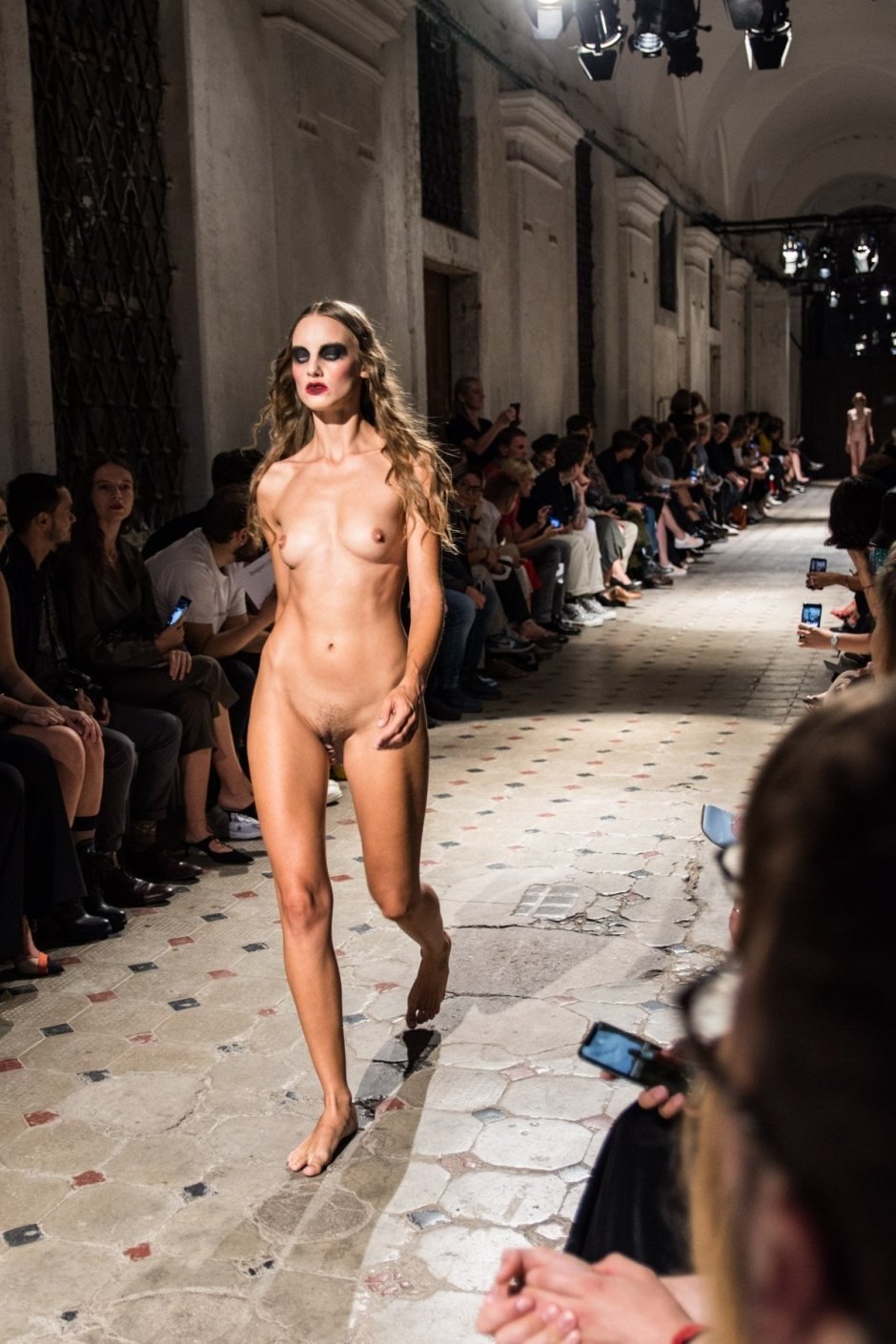 Naked fashion model on the catwalk