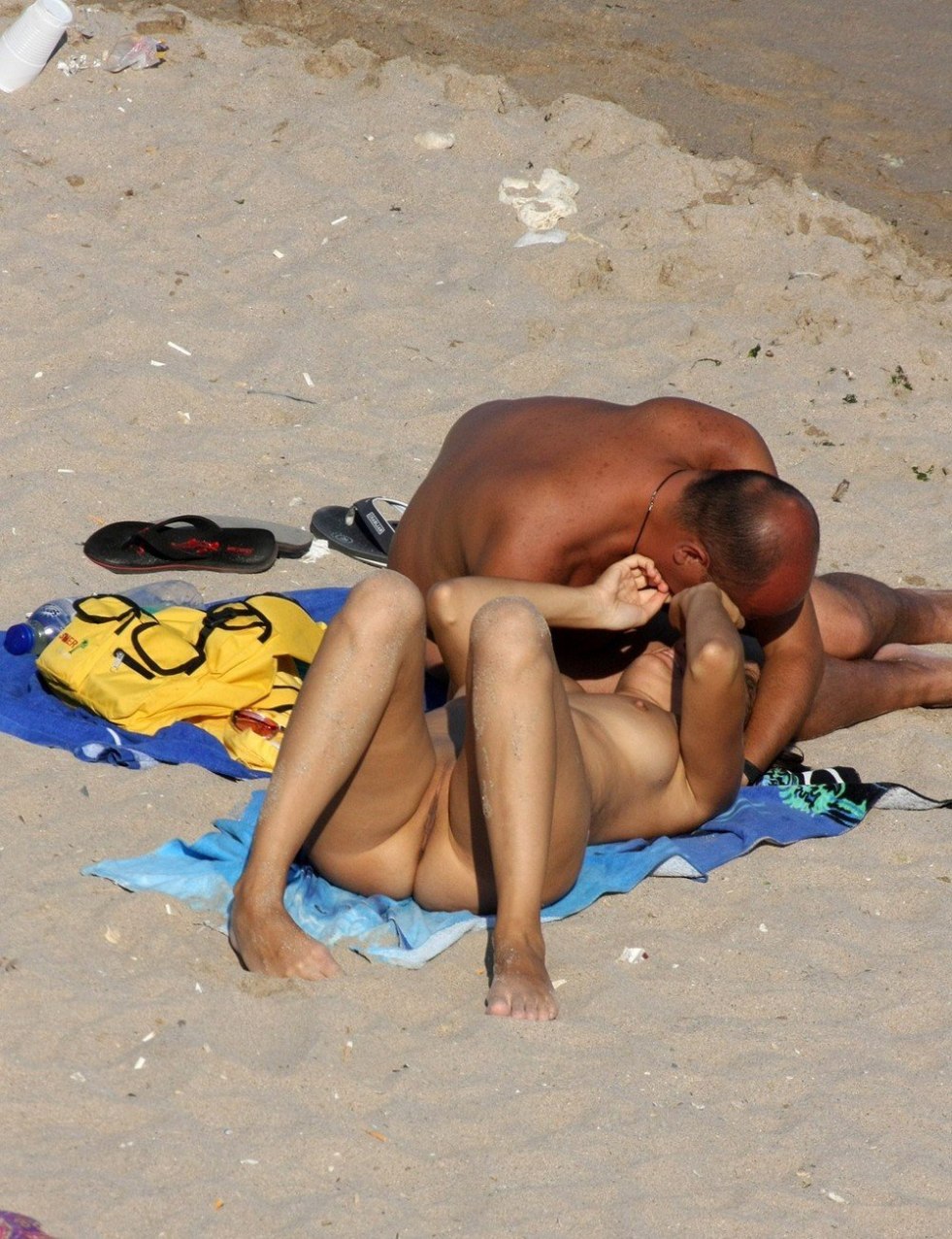 Naked men and women on the beach