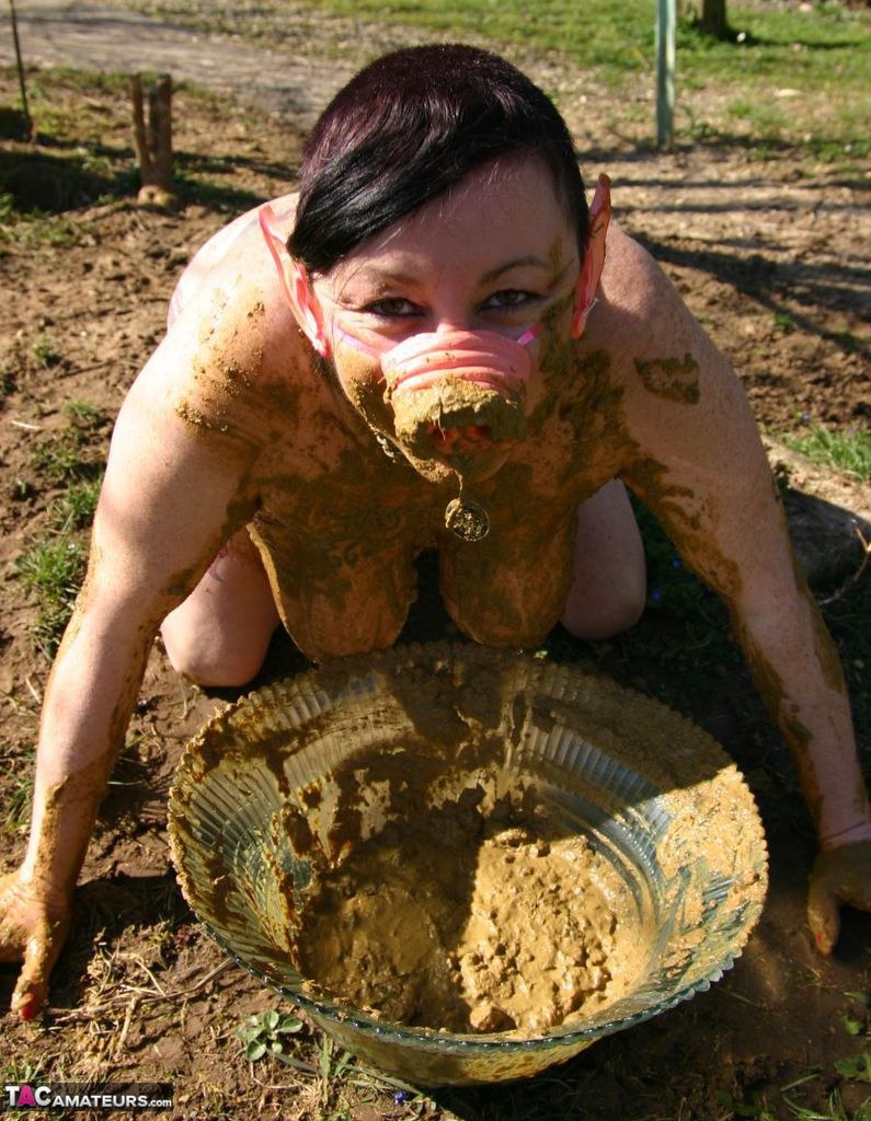 Naked women bathe in the mud