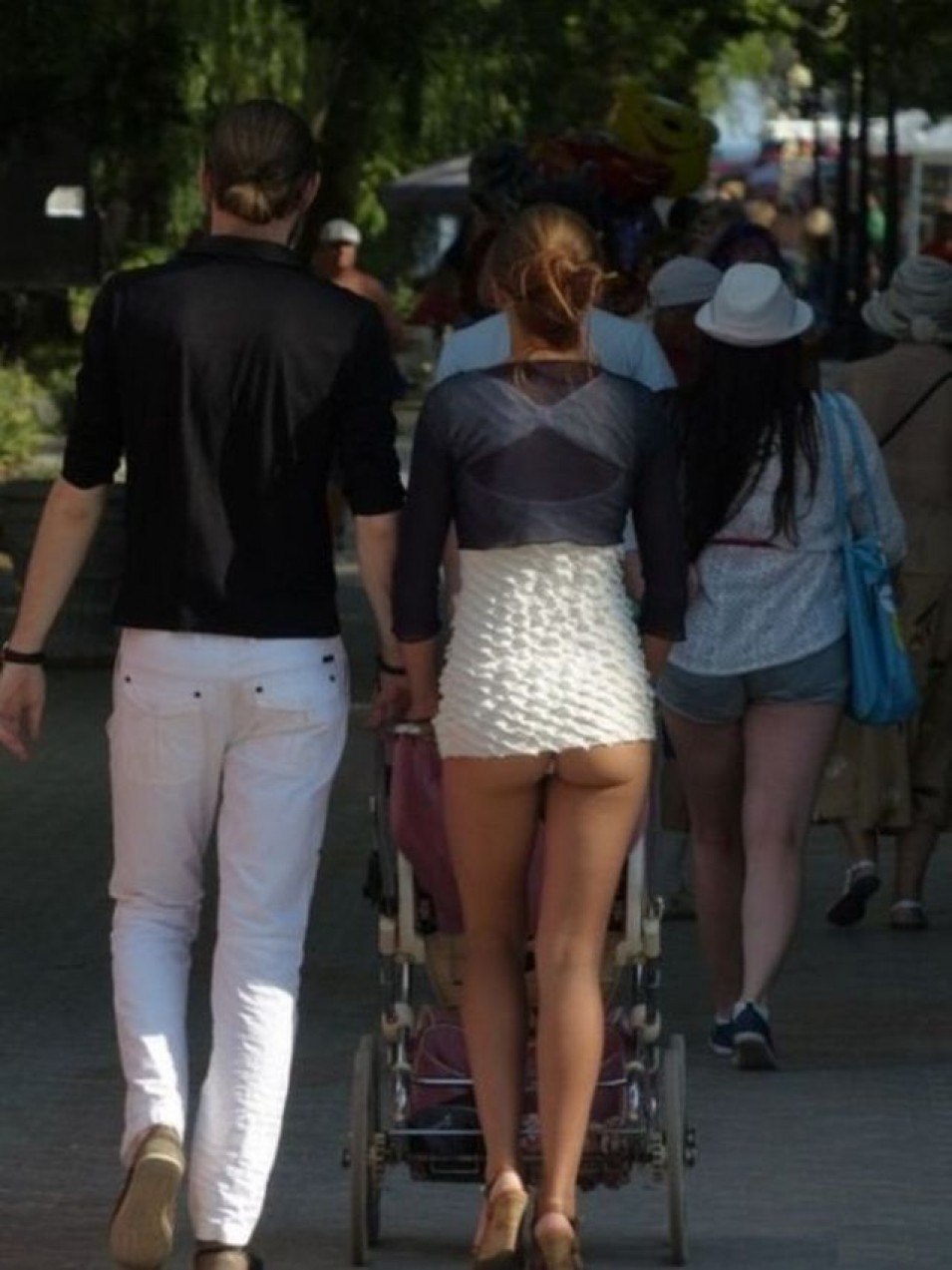 Woman undresses on the street