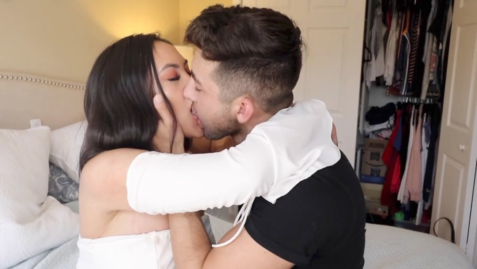 Woman on top of a man sitting