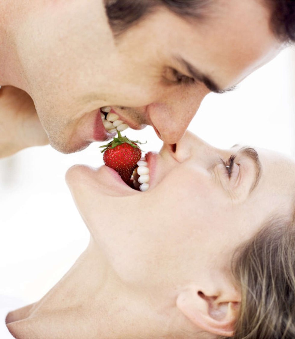 The girl kisses the guy in the back