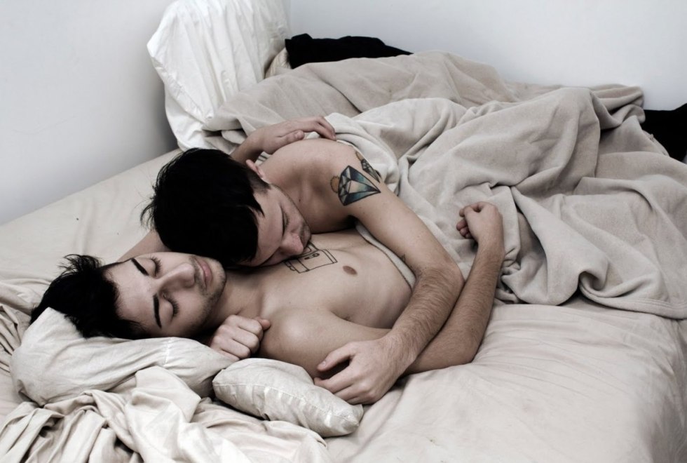 A man carries coffee to bed