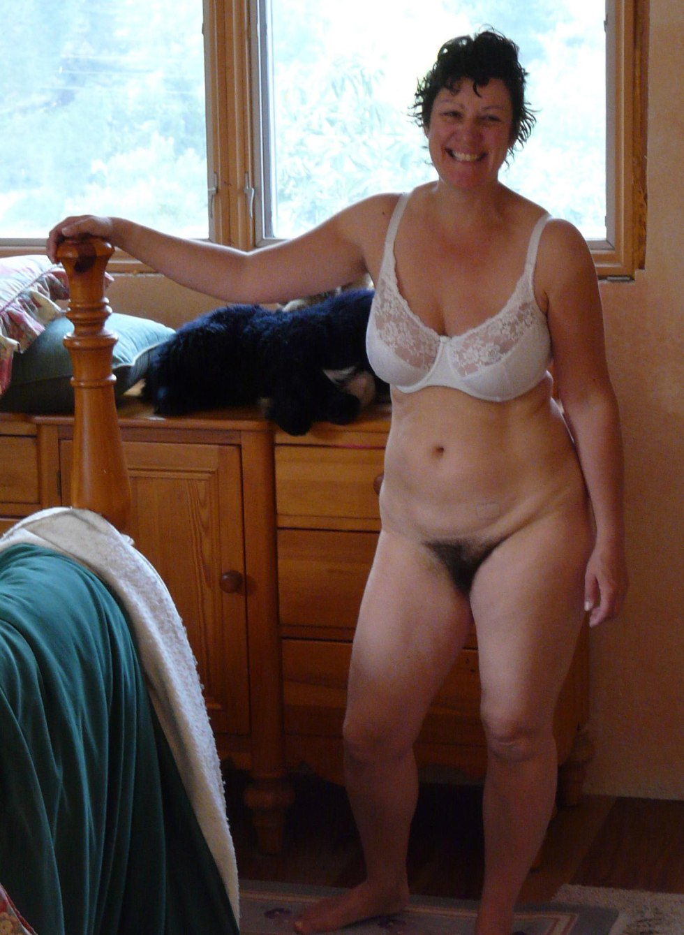 Mature women in a T -shirt without panties