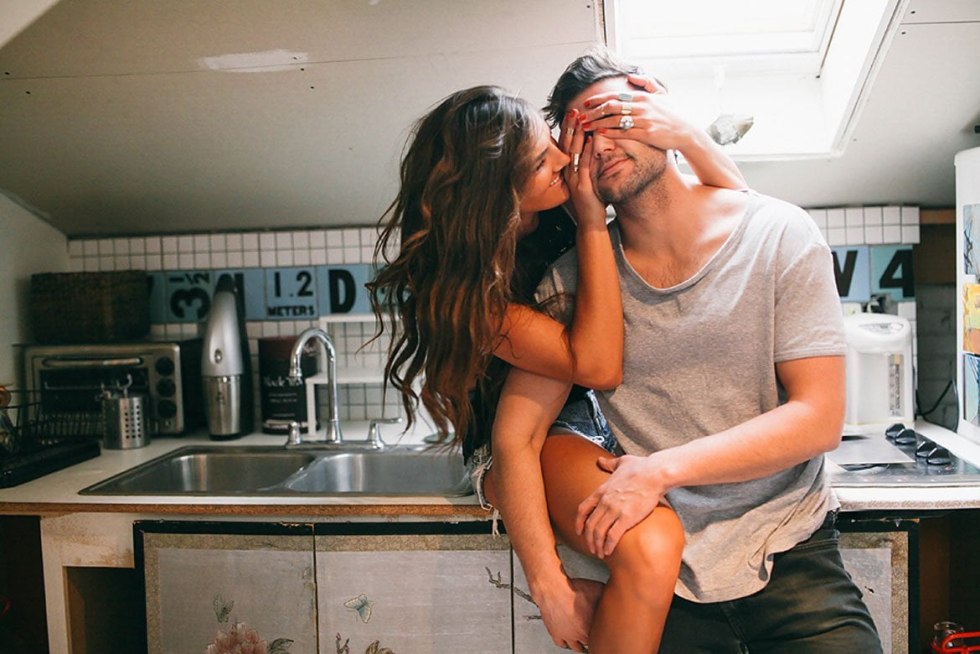 Photoshoot of a couple in underwear in the kitchen