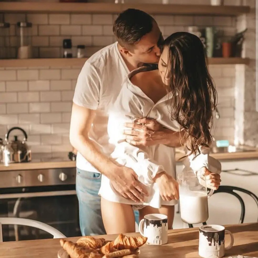 A man carries breakfast to bed