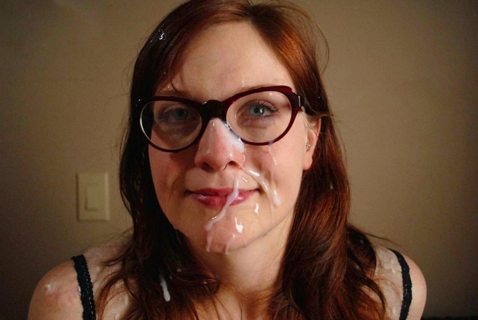 Red -haired girl with glasses cum on the face