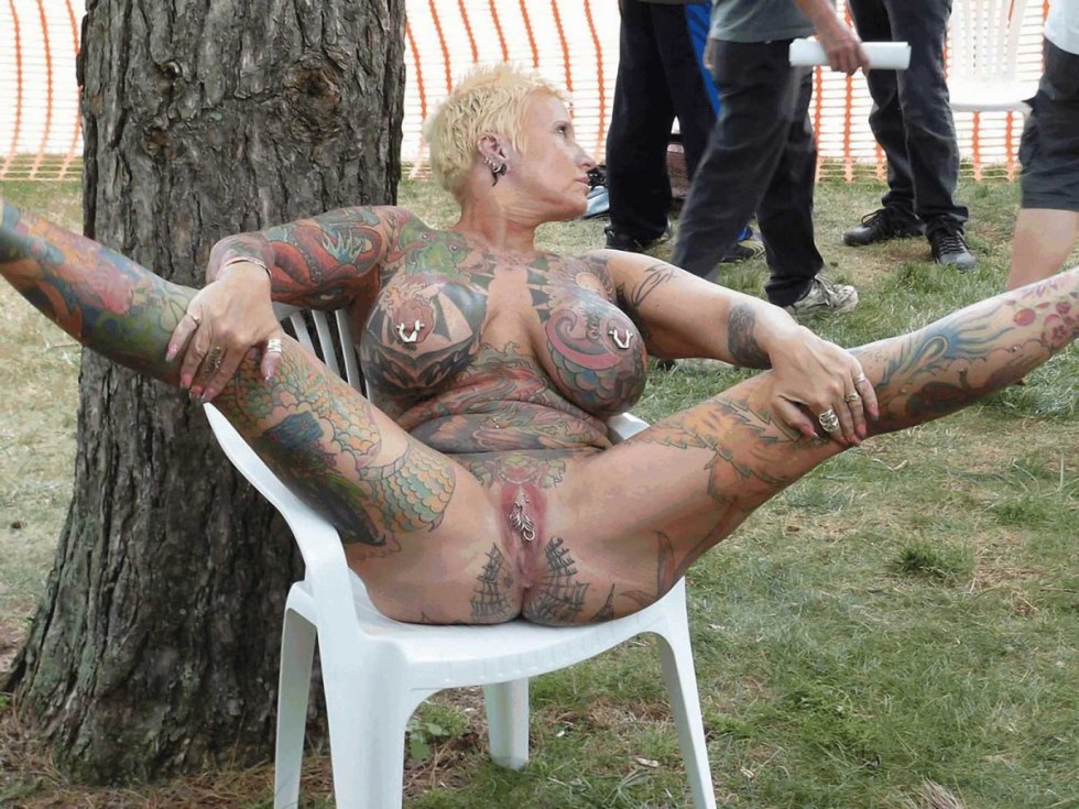 Naked women with tattoos on clit