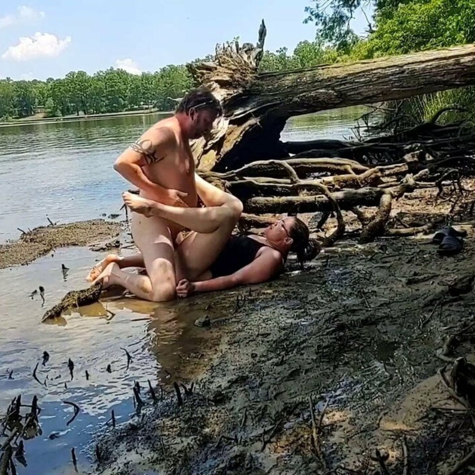 Naked women are lying in mud