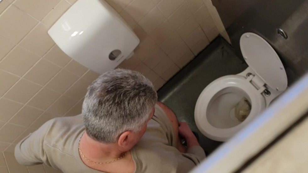 Through a hole in the wall of the lesbian