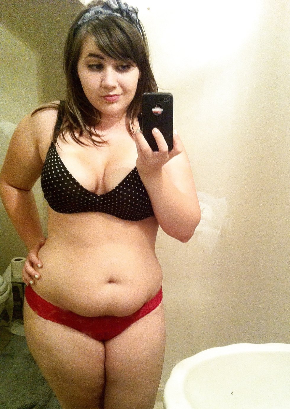 Fat girl in front of the mirror