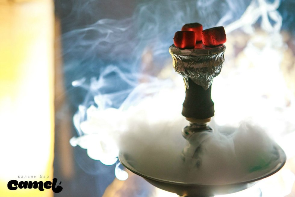 Girl with hookah in smoke