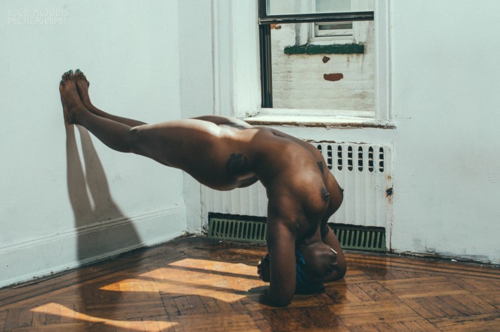 Naked black gymnast