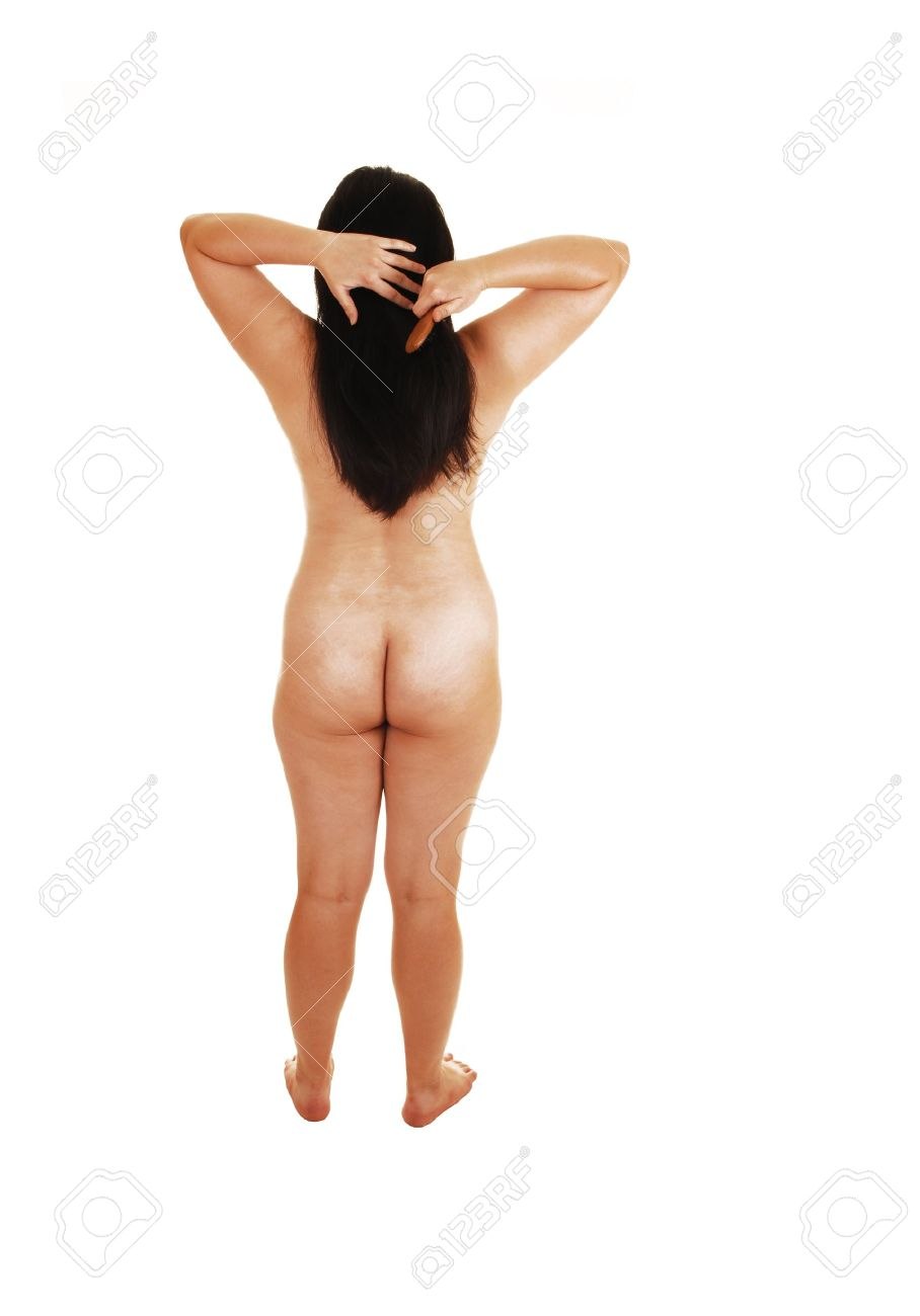 Naked woman with raised arms behind