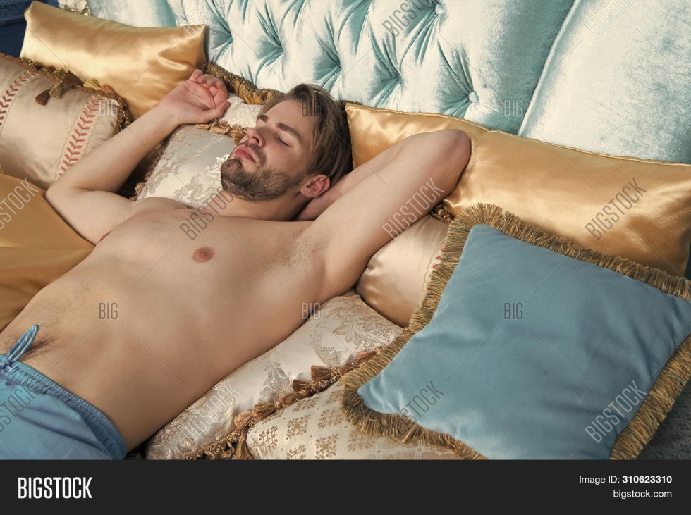 The guy touches the sleeping man