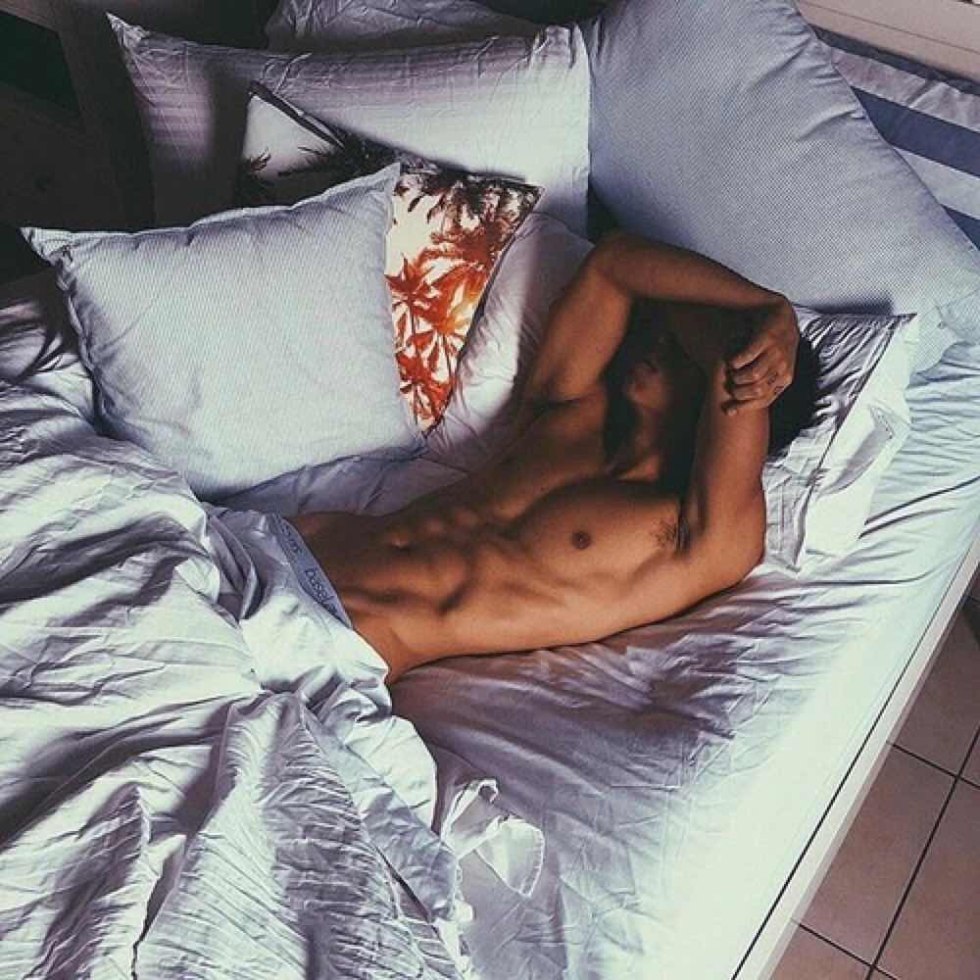 Male back on the bed