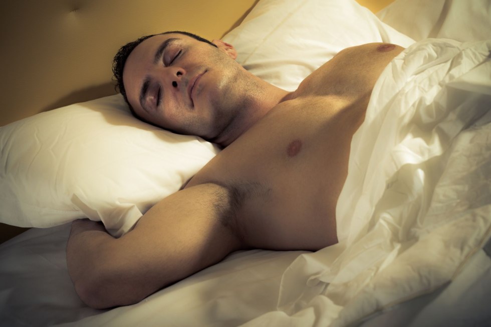 Man with standing in bed