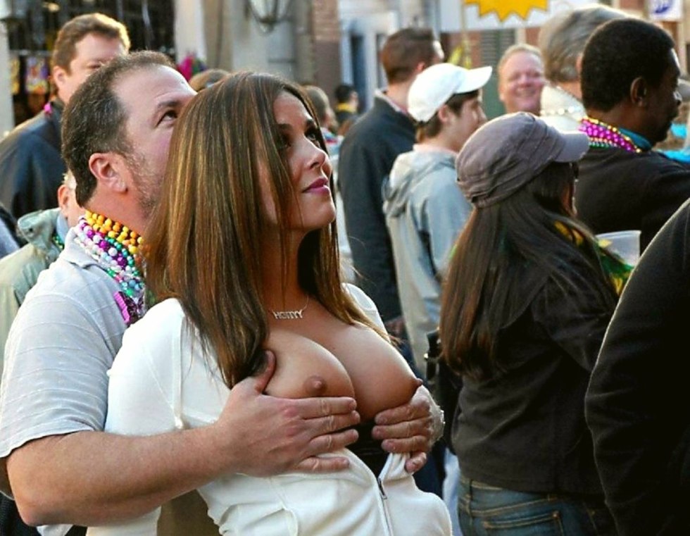 Girl shows her breasts in public