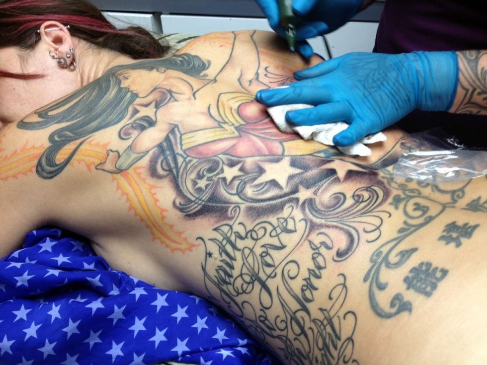 Woman in a tattoo salon