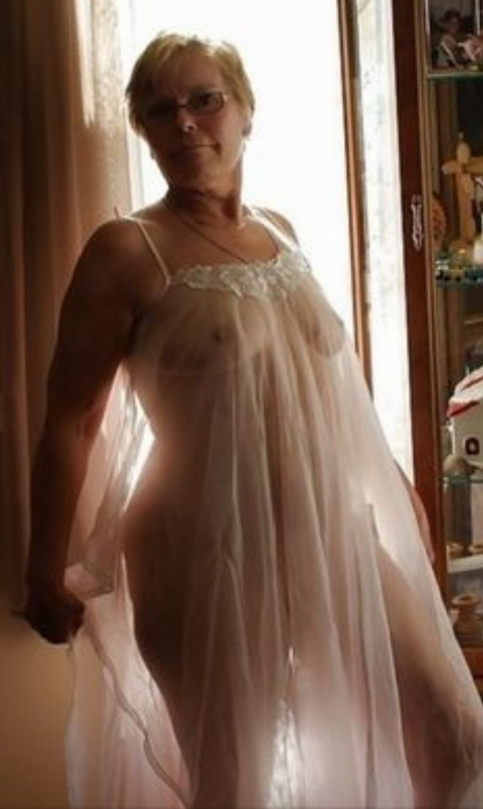 Mature in a transparent dress