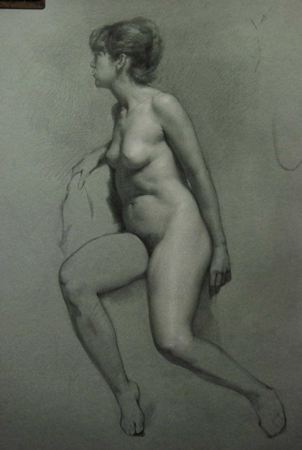 Drawing a naked woman from nature